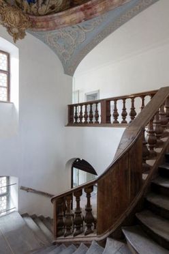 Historical stairwell at the TUM Science and Study Center Raitenhaslach with ceiling fresco.